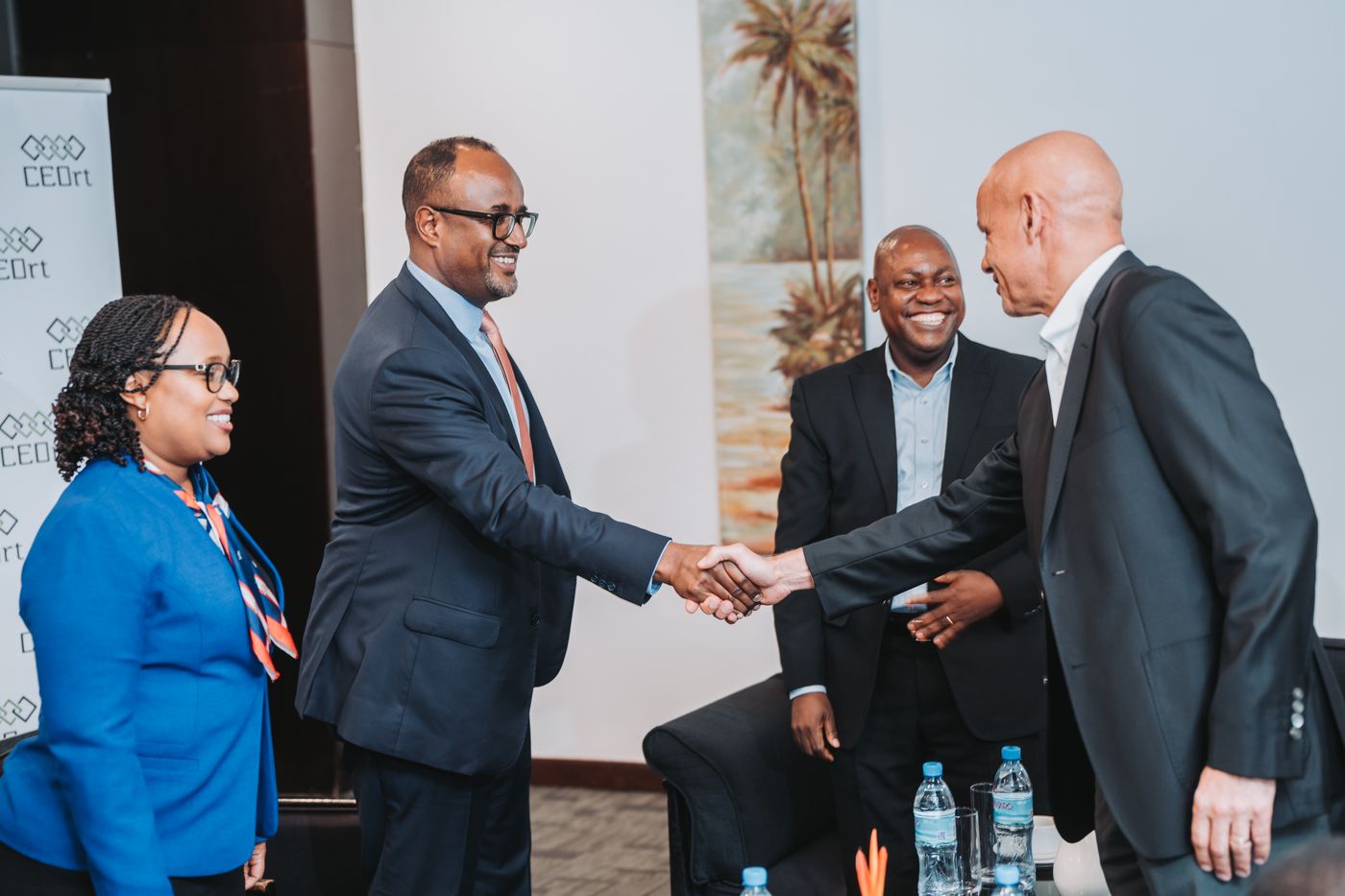 CEOrt members greeting one another before a session